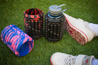 Three bottle rollers in three different colors with athletic shoes.